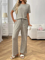 Women's ribbed knit short sleeve loungewear set with pockets, comfortable pajamas by Trendsi, ideal for relaxed home wear.
