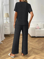 Women's ribbed knit short sleeve loungewear set with pockets, comfortable pajamas from Trendsi, perfect for relaxed home wear.
