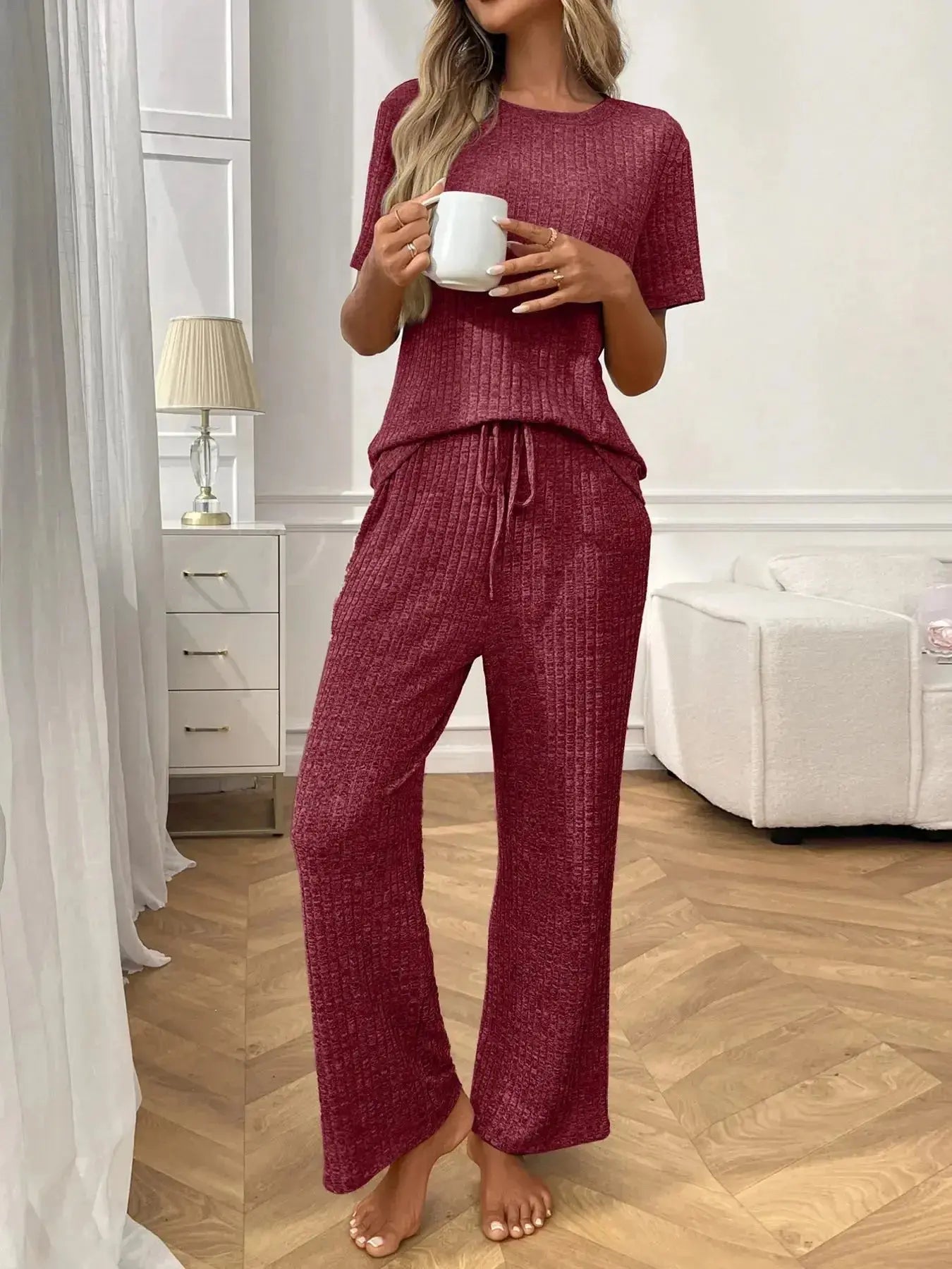 Women's ribbed knit short sleeve pajama loungewear set with pockets from Trendsi, featuring a comfortable and stylish design.