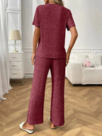 Women's ribbed knit short sleeve loungewear set with pockets, comfortable pajamas by Trendsi, perfect for relaxing at home.