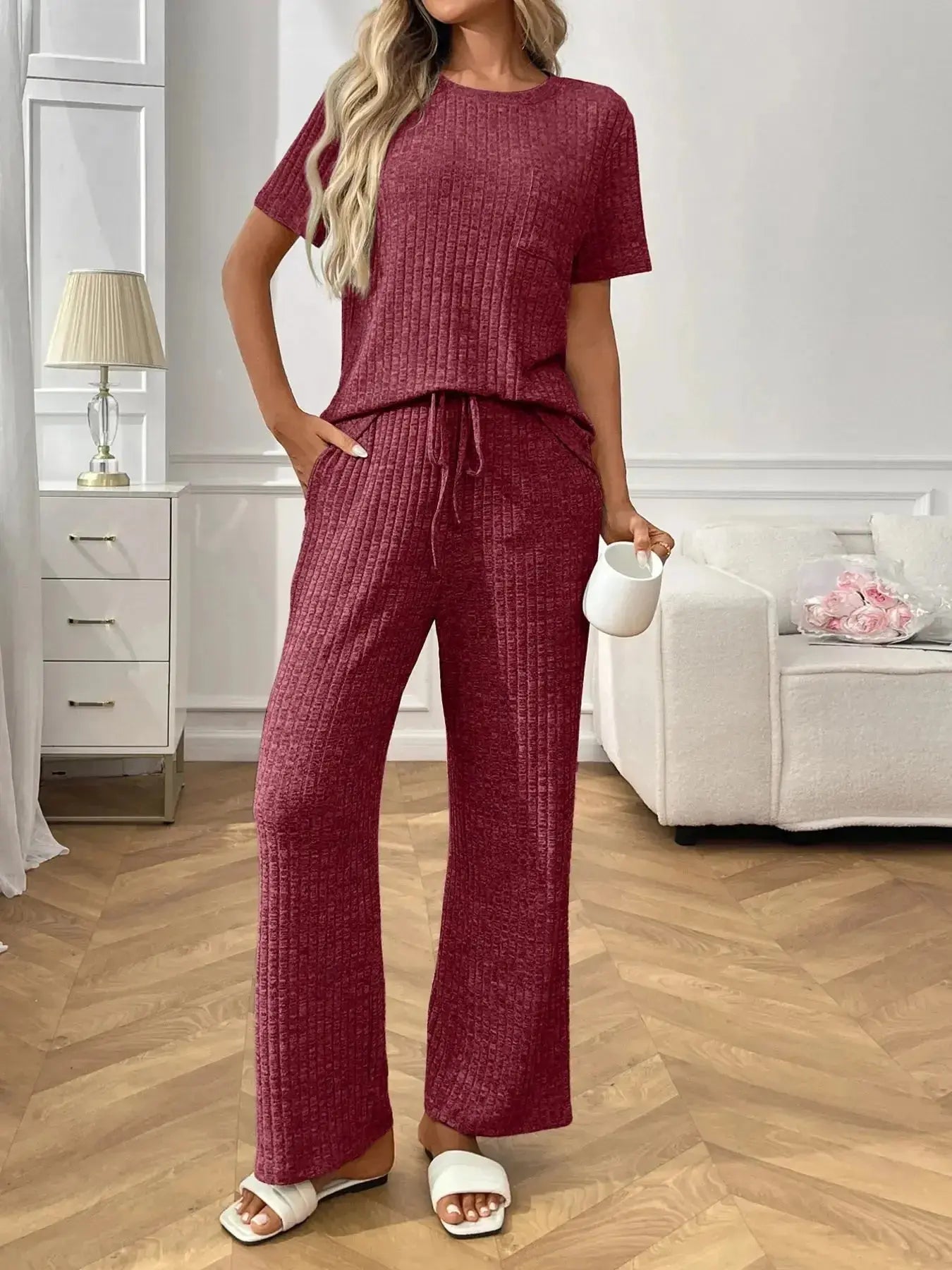 Women's ribbed knit short sleeve pajama set with pockets, comfortable loungewear by Trendsi, perfect for relaxing at home.