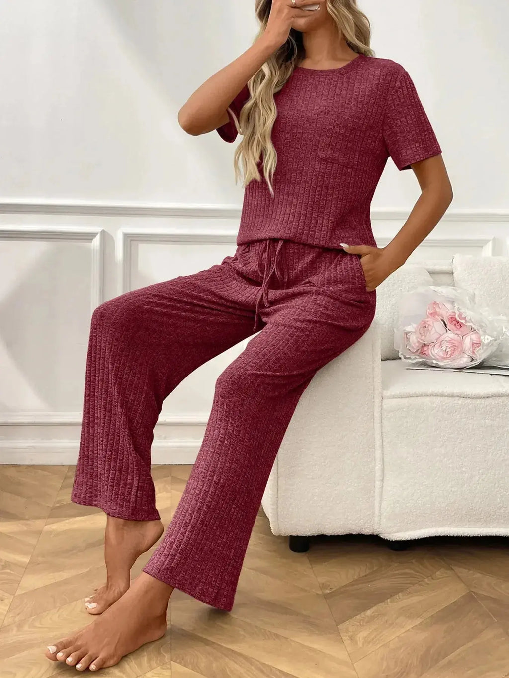 Women's ribbed knit short sleeve loungewear set with pockets, comfortable pajamas by Trendsi, featuring a relaxed fit and cozy fabric.