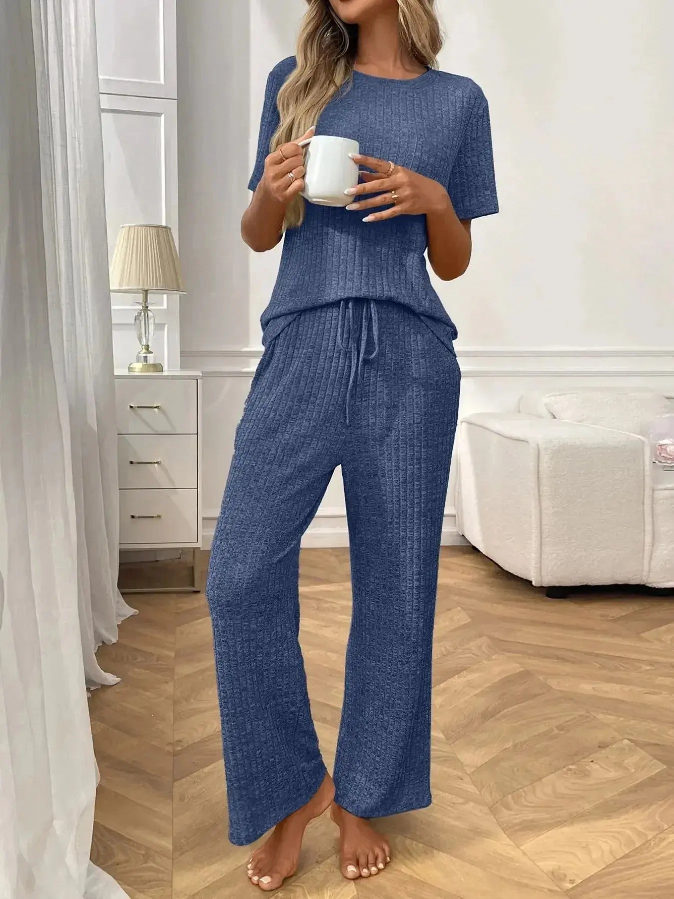 Women's ribbed knit short sleeve loungewear set with pockets, comfortable pajamas by Trendsi, perfect for relaxing at home.