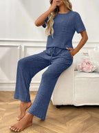 Women’s ribbed knit short sleeve loungewear set with pockets, cozy pajamas by Trendsi, featuring a comfortable, relaxed fit.