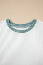 Women's ribbed knit sleeveless tank top with contrast trim, soft fitted shirt by Trendsi, shown in a close-up view of the design.