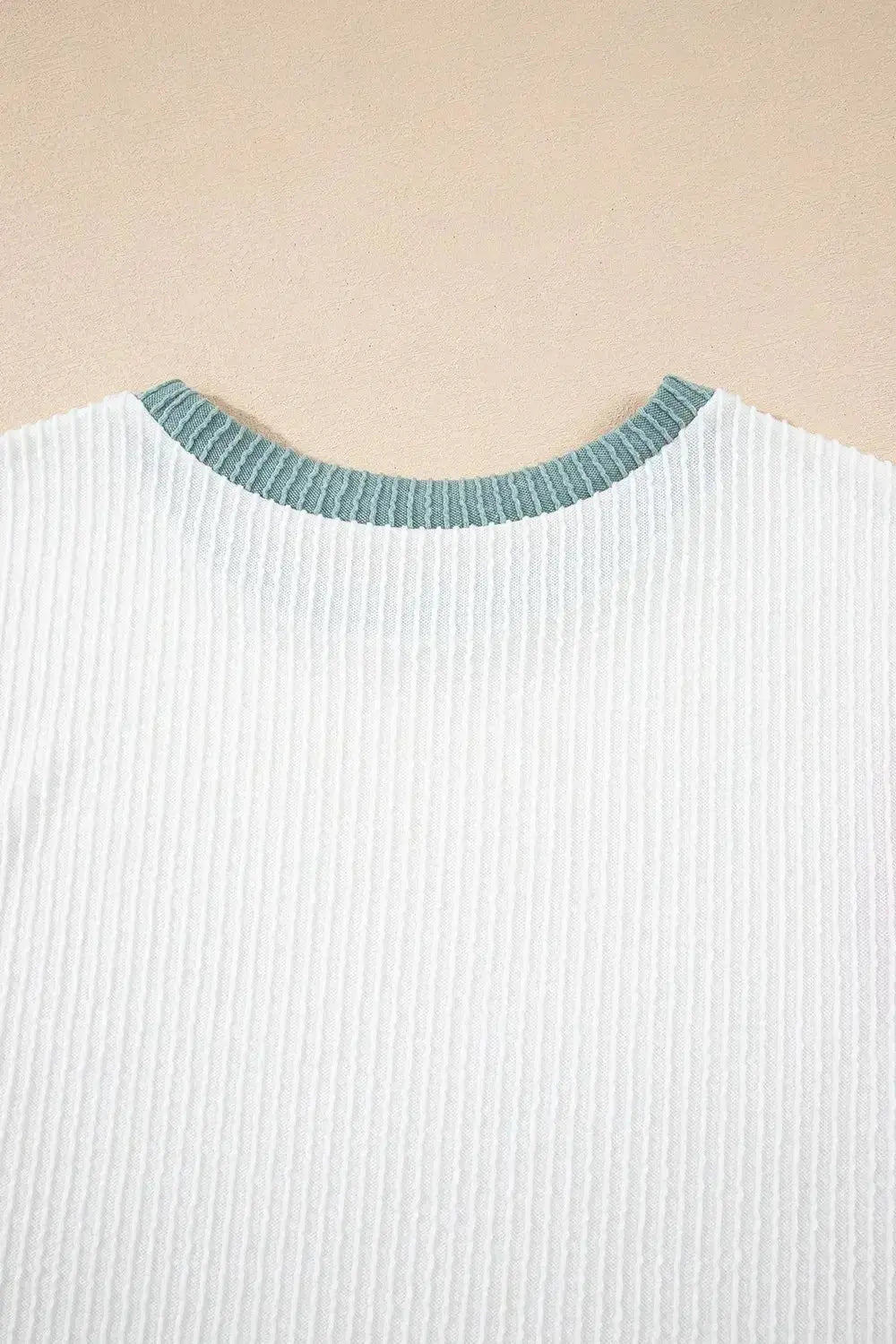 Women's ribbed knit sleeveless tank top with contrast trim, soft fitted shirt from Trendsi featuring a stylish, casual design.
