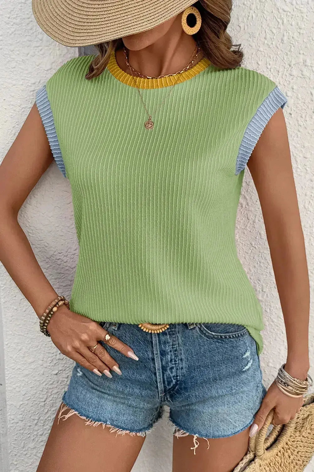 Women's ribbed knit sleeveless tank top with contrast trim, soft fitted shirt from Trendsi, featuring a stylish and comfortable design.