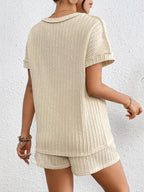 Women's ribbed round neck lounge set with soft two-piece top and shorts, comfortable pajama set by Trendsi.