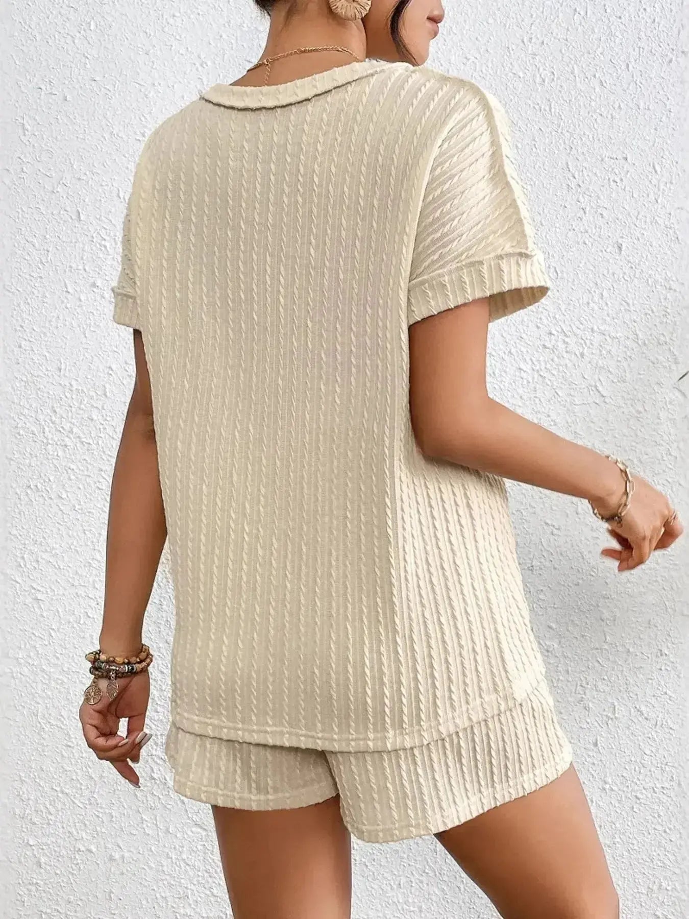 Women's ribbed round neck lounge set with soft two-piece top and shorts, comfortable pajama set by Trendsi.