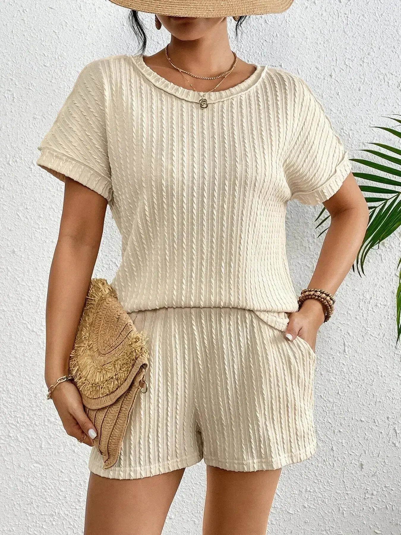 Women's ribbed round neck lounge set with soft two-piece top and shorts, comfortable pajama set by Trendsi.