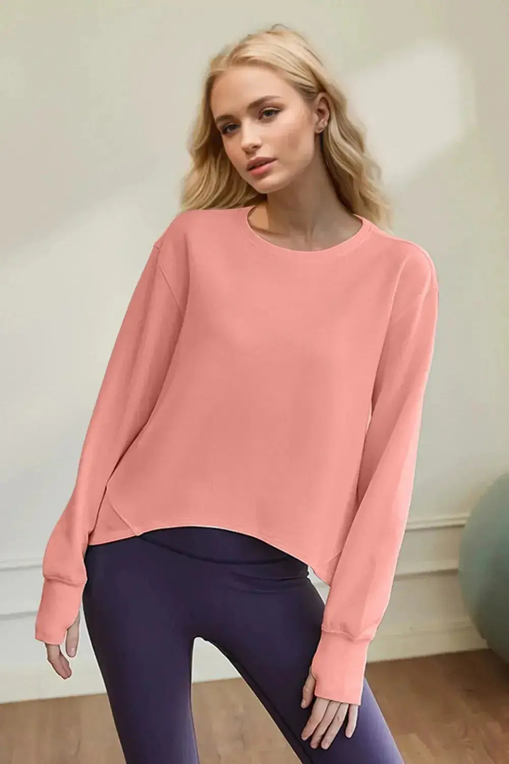 Women's scuba long sleeve round neck sweatshirt by Trendsi, featuring a minimalist design and comfortable everyday style.