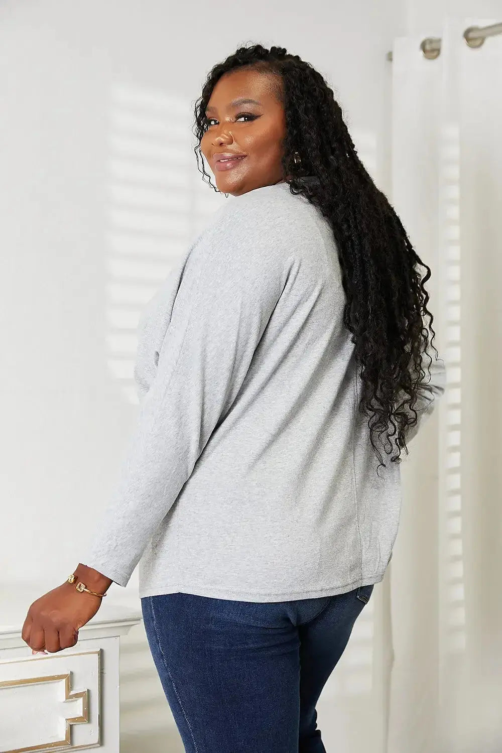 Women's long sleeve round neck top with seam details by Trendsi, a comfortable everyday shirt perfect for casual wear.