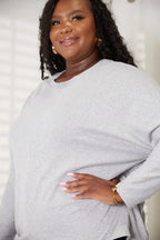 Women's long sleeve round neck top with seam detail, comfortable everyday shirt by Trendsi.