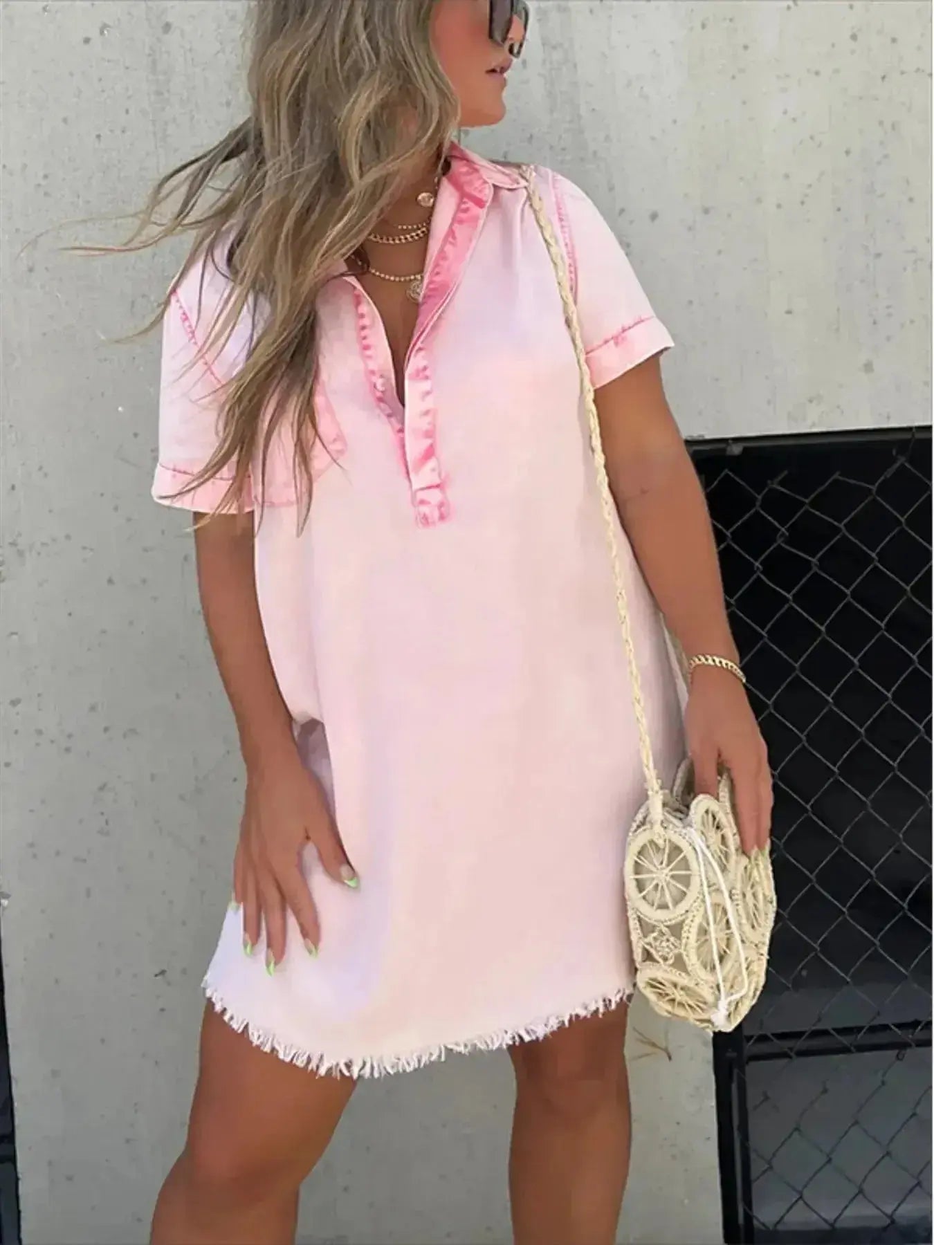 Women's short sleeve raw hem denim button-down dress by Plush Fashion Hub, featuring a casual, stylish denim design.
