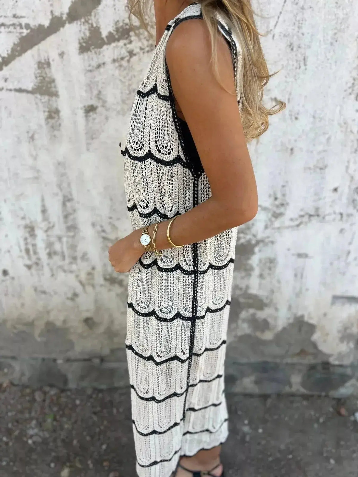 Women's sleeveless crochet longline cardigan with openwork knit design, button front vest by Plush Fashion Hub.