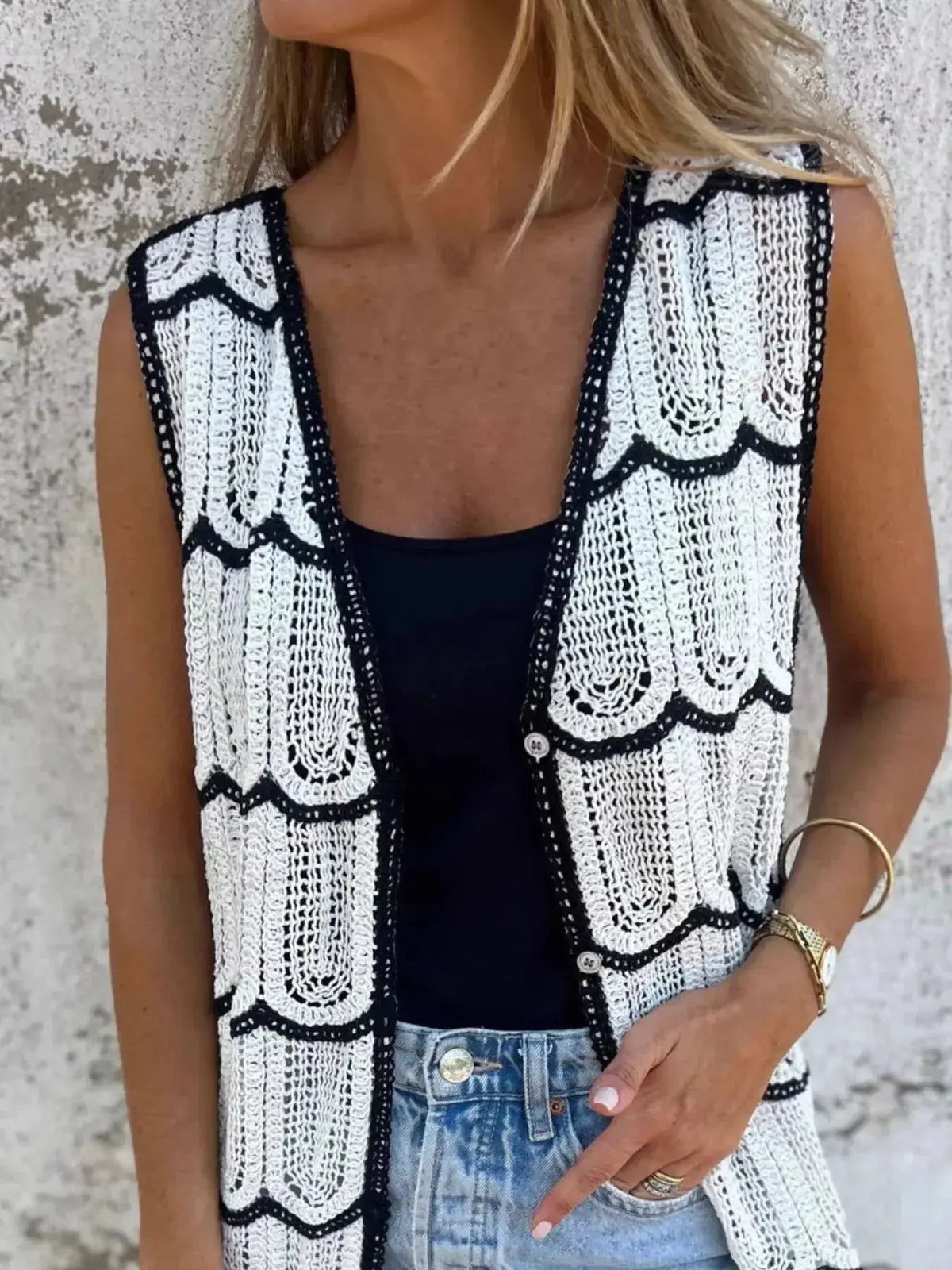Women’s sleeveless crochet longline cardigan with openwork knit pattern and button front, from Plush Fashion Hub.