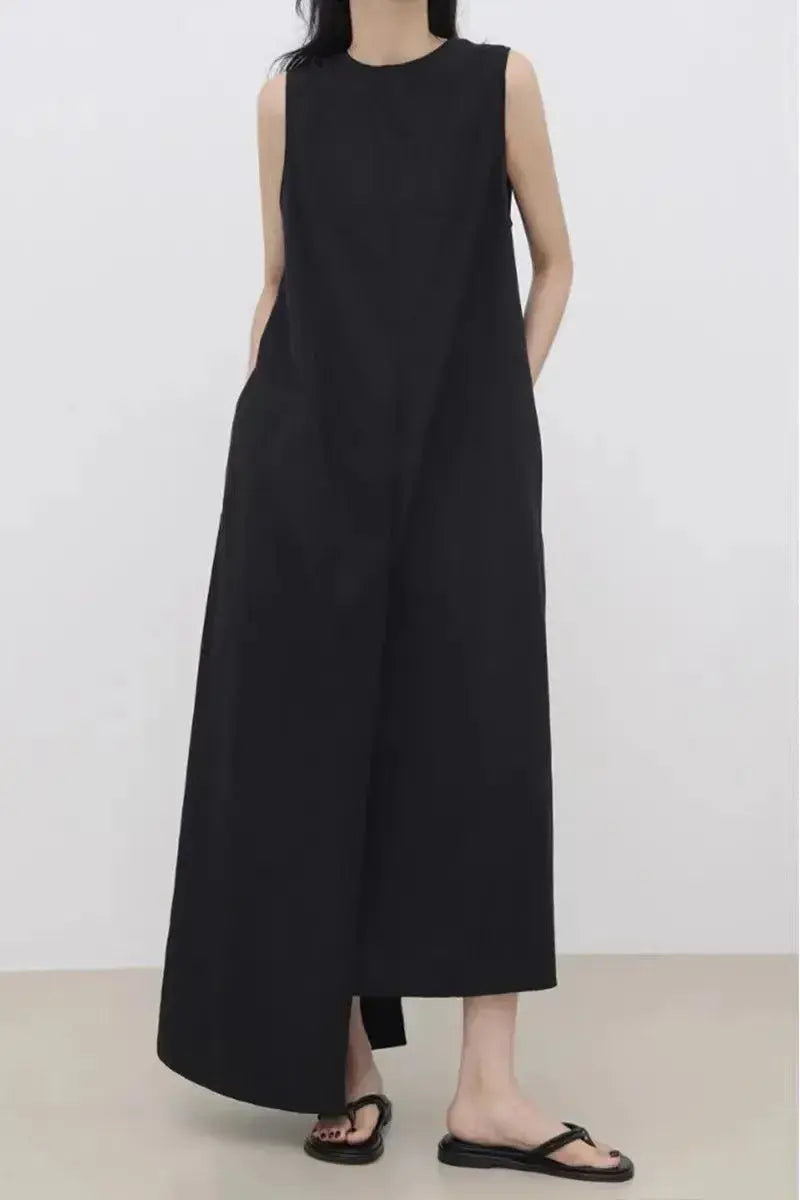Women’s sleeveless solid color irregular hem long dress by Plush Fashion Hub, flowing maxi dress with unique hem detail.