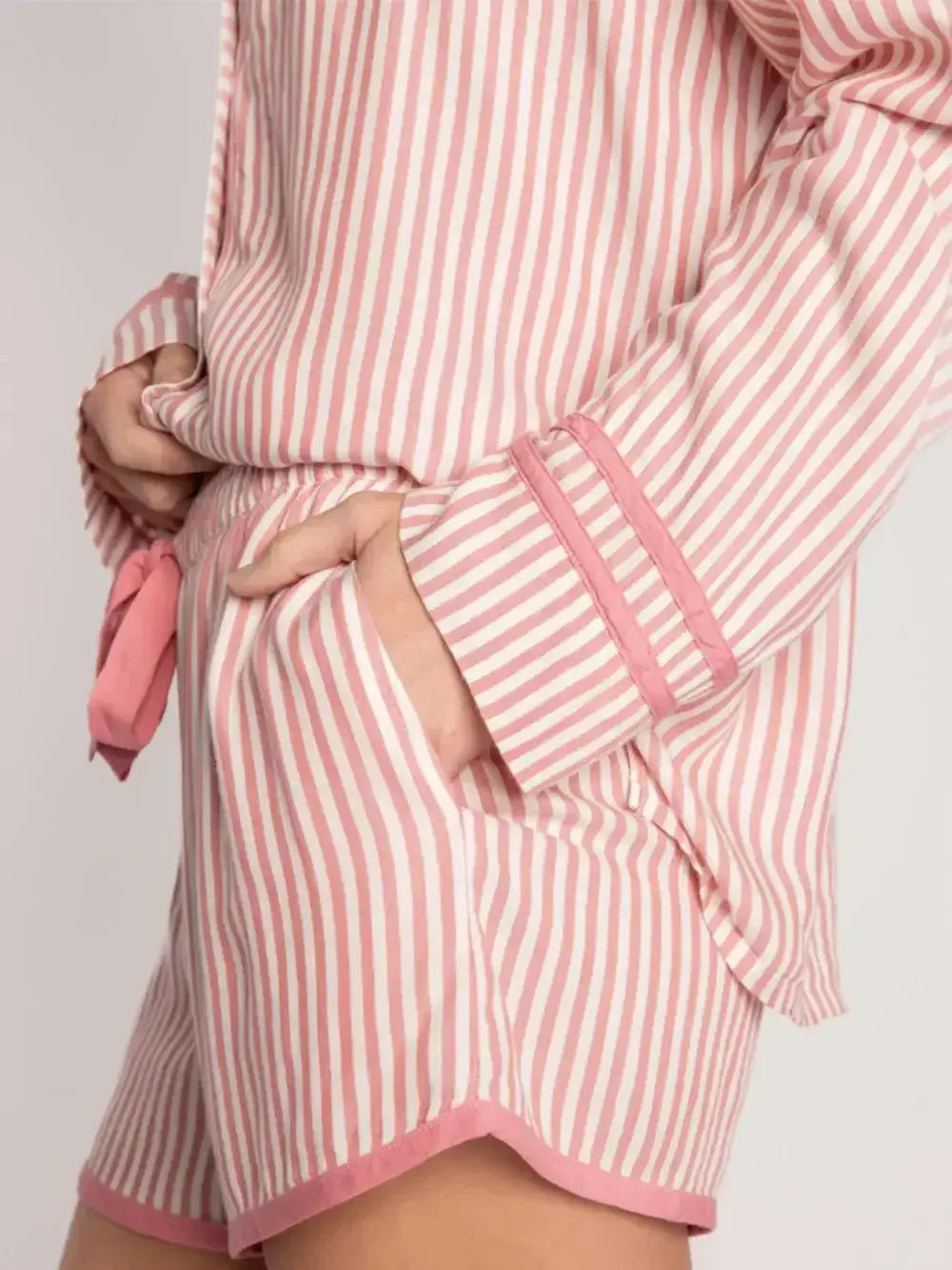 Women’s striped collared long sleeve top and shorts lounge set, trendy pajamas by Trendsi, comfortable and stylish sleepwear ensemble.