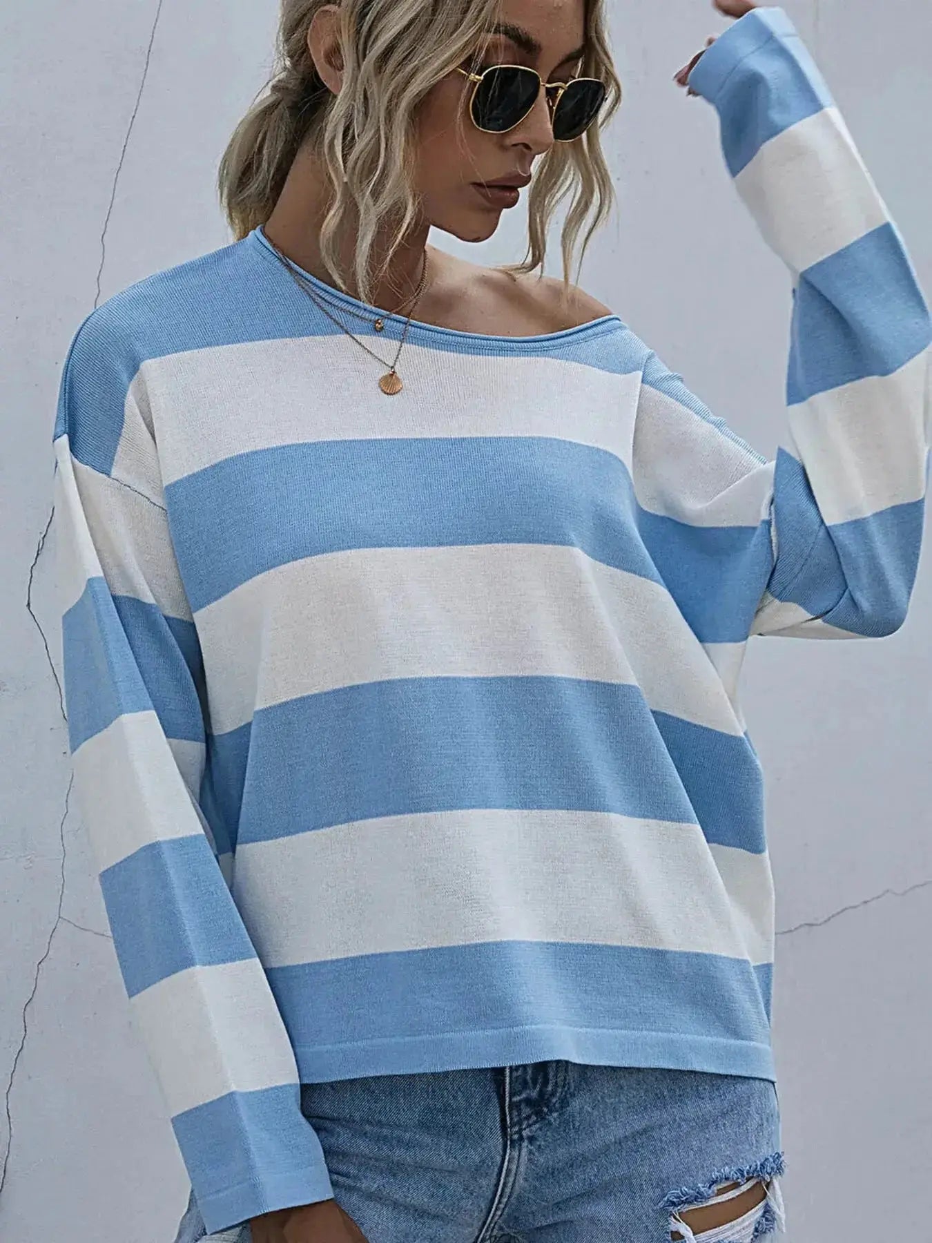 Women's striped long sleeve knit casual crewneck top by Trendsi, featuring a comfortable fit and classic design.