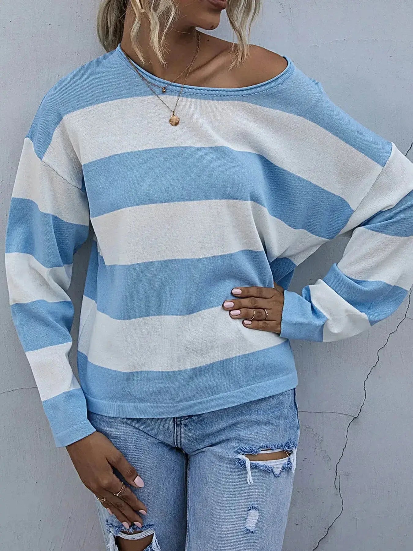 Women's striped long sleeve knit casual crewneck top by Trendsi, featuring a comfortable fit and classic design.