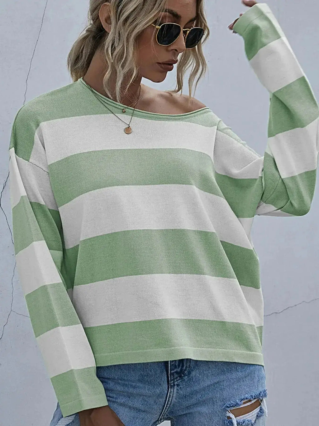 Women's striped long sleeve knit casual crewneck top by Trendsi, featuring a comfortable fit and classic design.