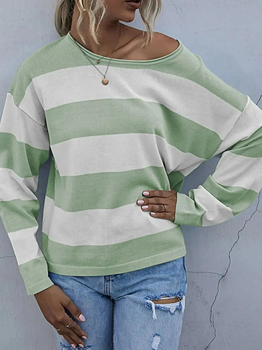 Women's striped long sleeve knit casual crewneck top by Trendsi, featuring a comfortable fit and stylish pattern.