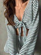 Women’s striped long sleeve pajama top and shorts set, soft and cozy sleepwear from Trendsi, featuring a relaxed fit and comfortable fabric.
