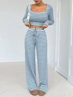 Women's striped square neck long sleeve loungewear set with matching pants from Trendsi, soft and comfortable two-piece ensemble.