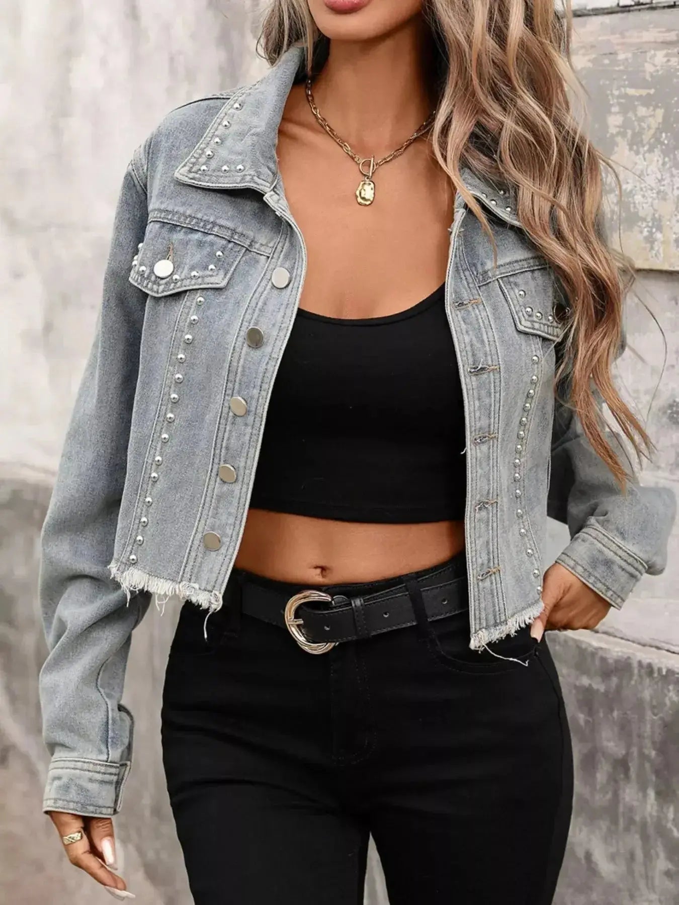 Women’s studded raw hem denim jacket with distressed details, stylish casual jean jacket by Trendsi for a trendy look.