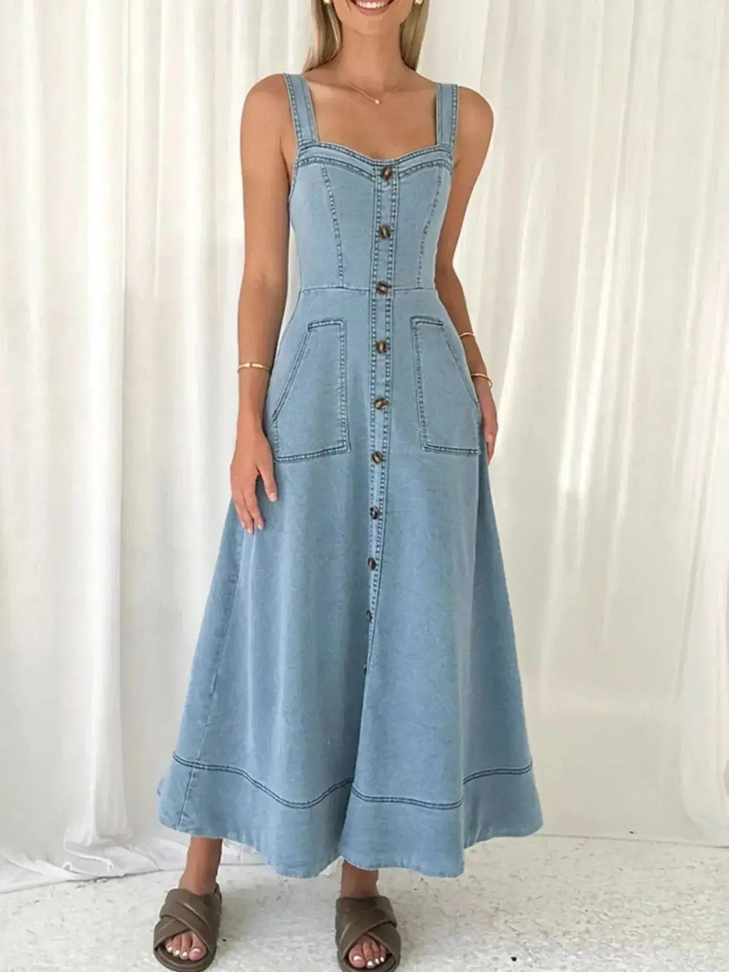 Women’s sweetheart neck denim dress with pockets, casual blue jean style, by Trendsi, featuring a fitted bodice and classic denim fabric.