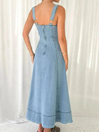 Women's sweetheart neck denim dress with pockets, casual blue jean dress by Trendsi, featuring a fitted bodice and front pockets.