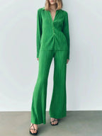Women’s textured long sleeve lounge set by Trendsi, cozy button-up pajama two-piece with soft fabric and relaxed fit.