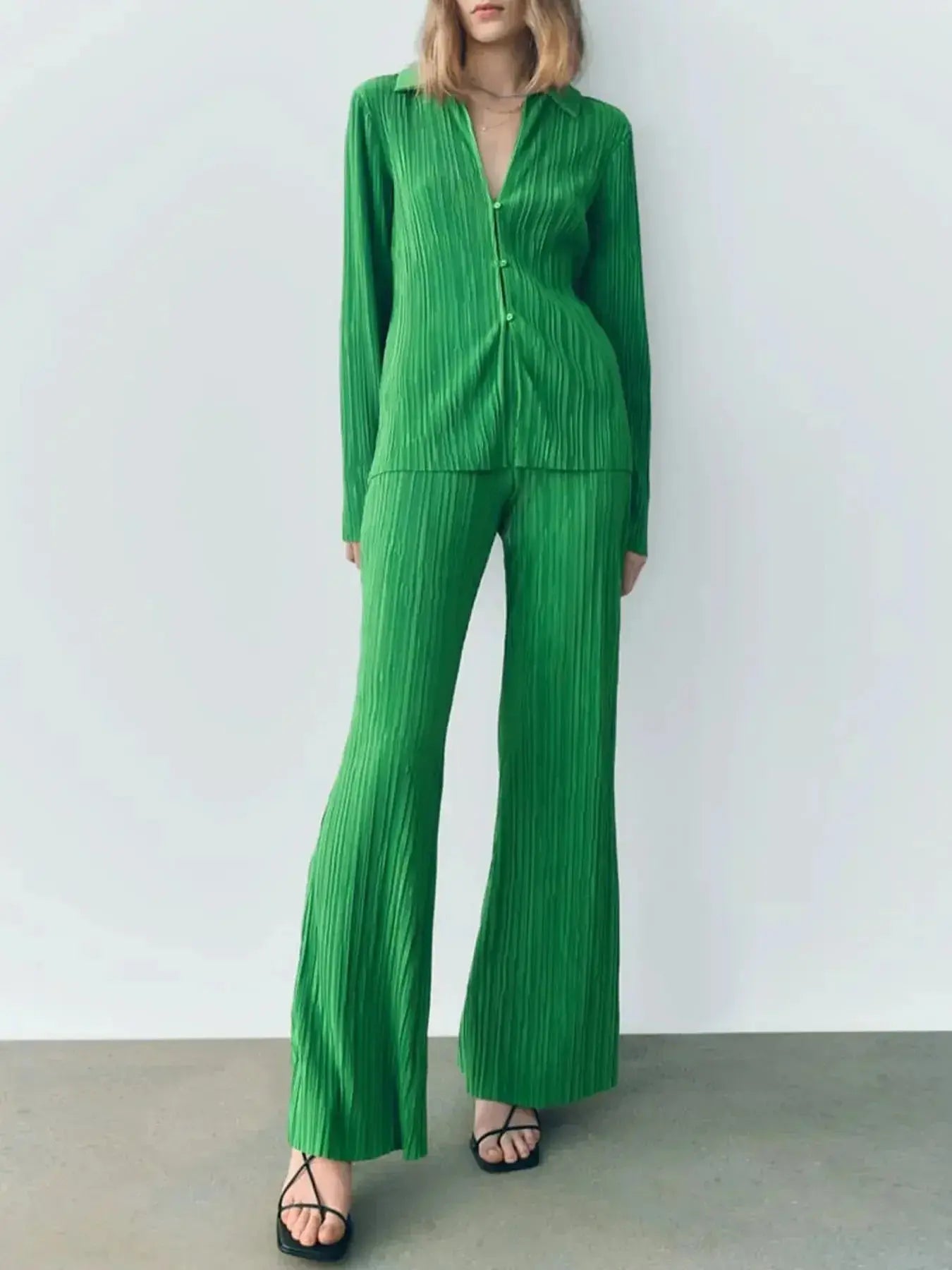 Women’s textured long sleeve lounge set by Trendsi, cozy button-up pajama two-piece with soft fabric and relaxed fit.