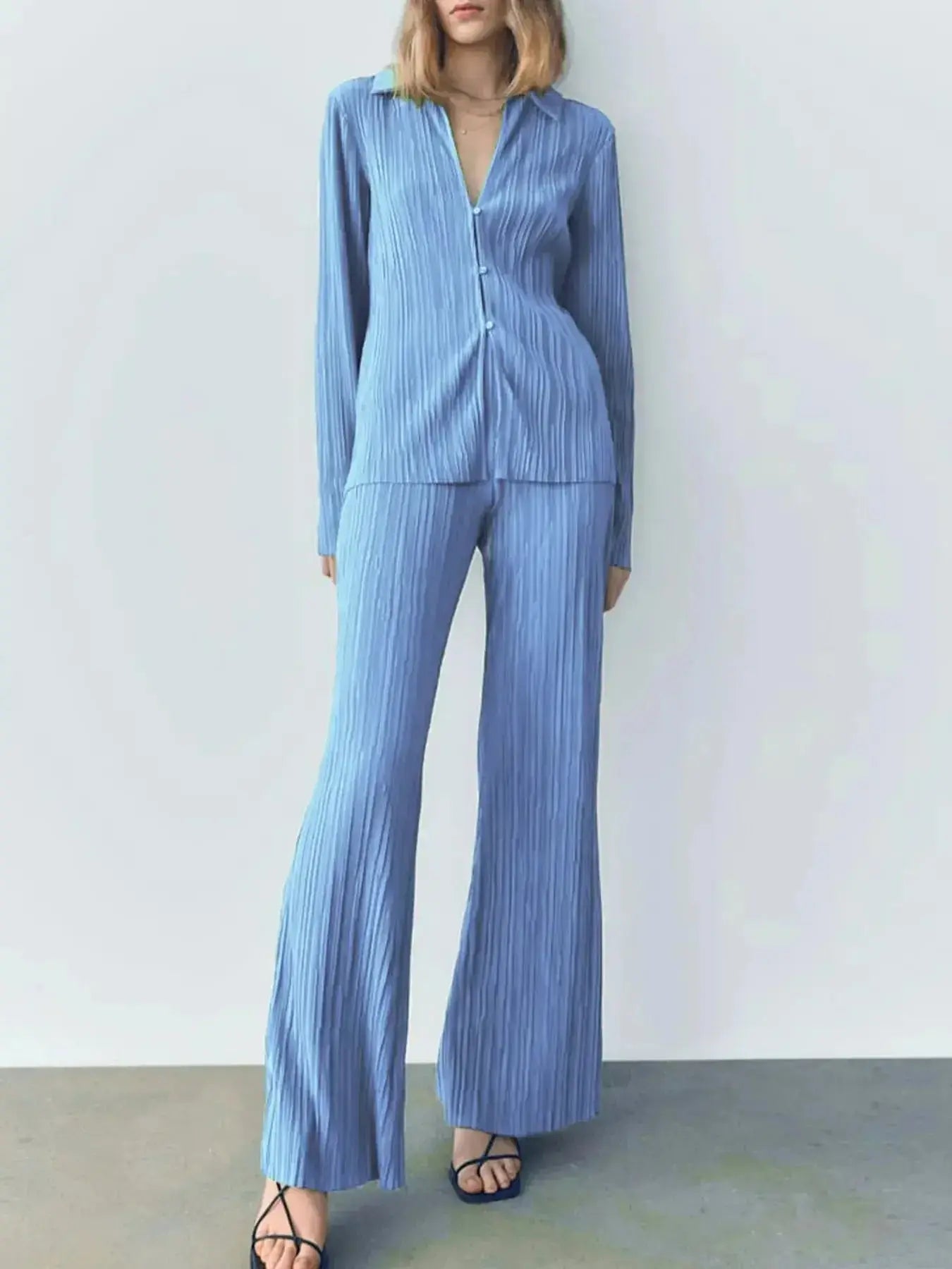 Women's textured long sleeve lounge set with cozy button-up top and matching pants, perfect for comfortable indoor wear.