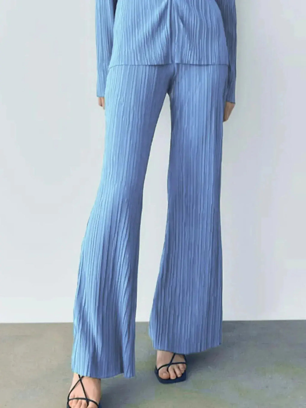 Women’s textured long sleeve lounge set with cozy button-up design, two-piece pajama set by Trendsi.