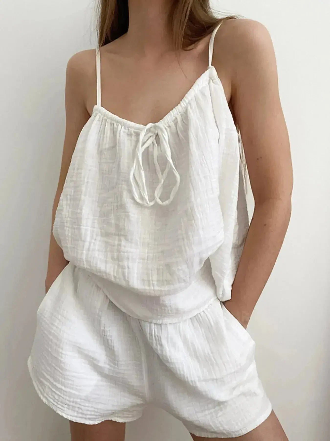 Women's tie-front cami and shorts loungewear set by Trendsi, soft stretch pajama set featuring a relaxed fit and comfortable fabric.