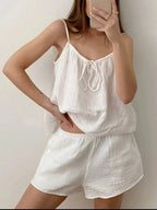 Women's tie-front cami and shorts loungewear set by Trendsi, soft stretch pajama set, comfortable sleepwear with relaxed fit.
