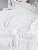 Women's tie-front cami and shorts loungewear set by Trendsi, soft stretch pajama set, comfortable sleepwear and relaxing home wear.