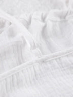 Women's tie-front cami and shorts loungewear set by Trendsi, soft stretch pajama set featuring a relaxed, comfortable fit.