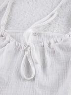 Women's tie-front cami and shorts loungewear set by Trendsi, soft stretch pajama set, comfortable sleepwear for women.