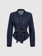Women's tie waist long sleeve denim jacket in structured cotton blend by Trendsi, featuring classic denim design and tailored fit.