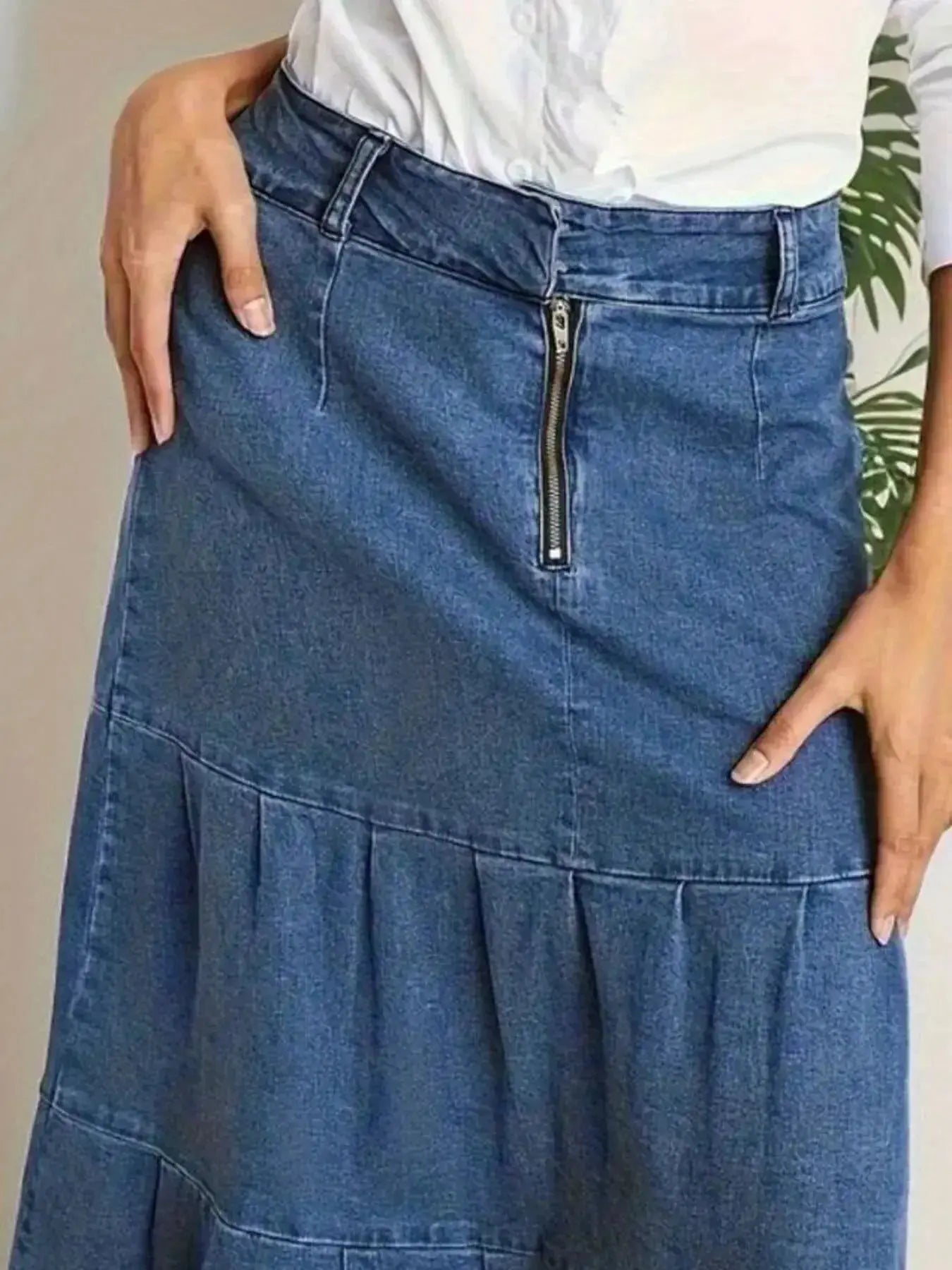Women's tiered maxi denim skirt with ruched zipper detail, stylish and casual fashion by Trendsi, shown on a model.