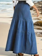 Women's tiered maxi denim skirt with ruched zipper detail, stylish trendy denim skirt for casual and fashionable looks.
