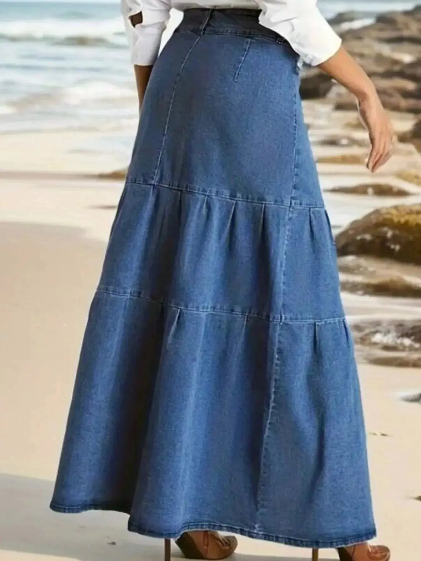 Women's tiered maxi denim skirt with ruched zipper detail, stylish trendy denim skirt for casual and fashionable looks.
