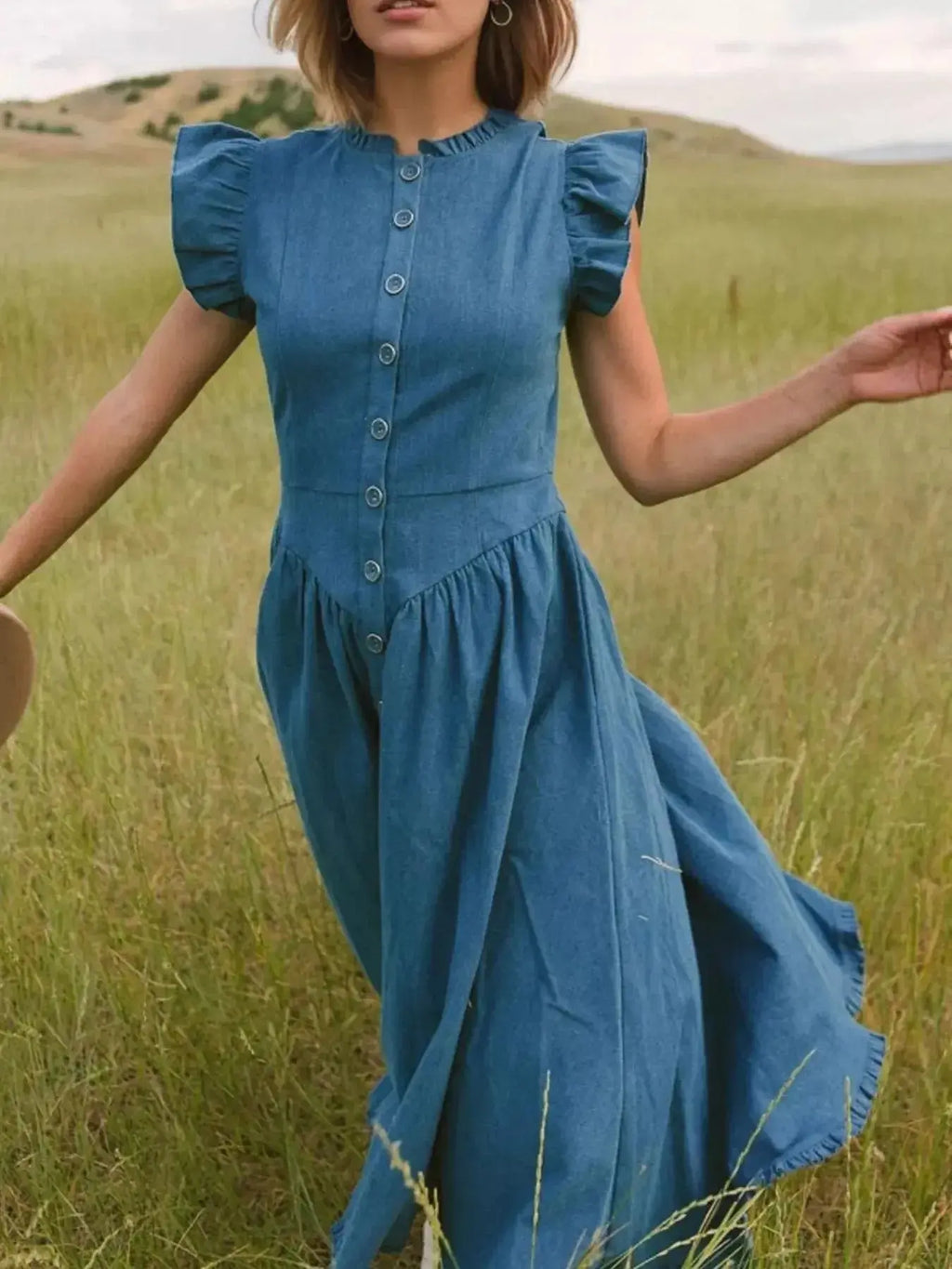 Women’s tiered ruffled cap sleeve denim dress by Trendsi, casual midi summer dress with ruffle details and a relaxed fit.