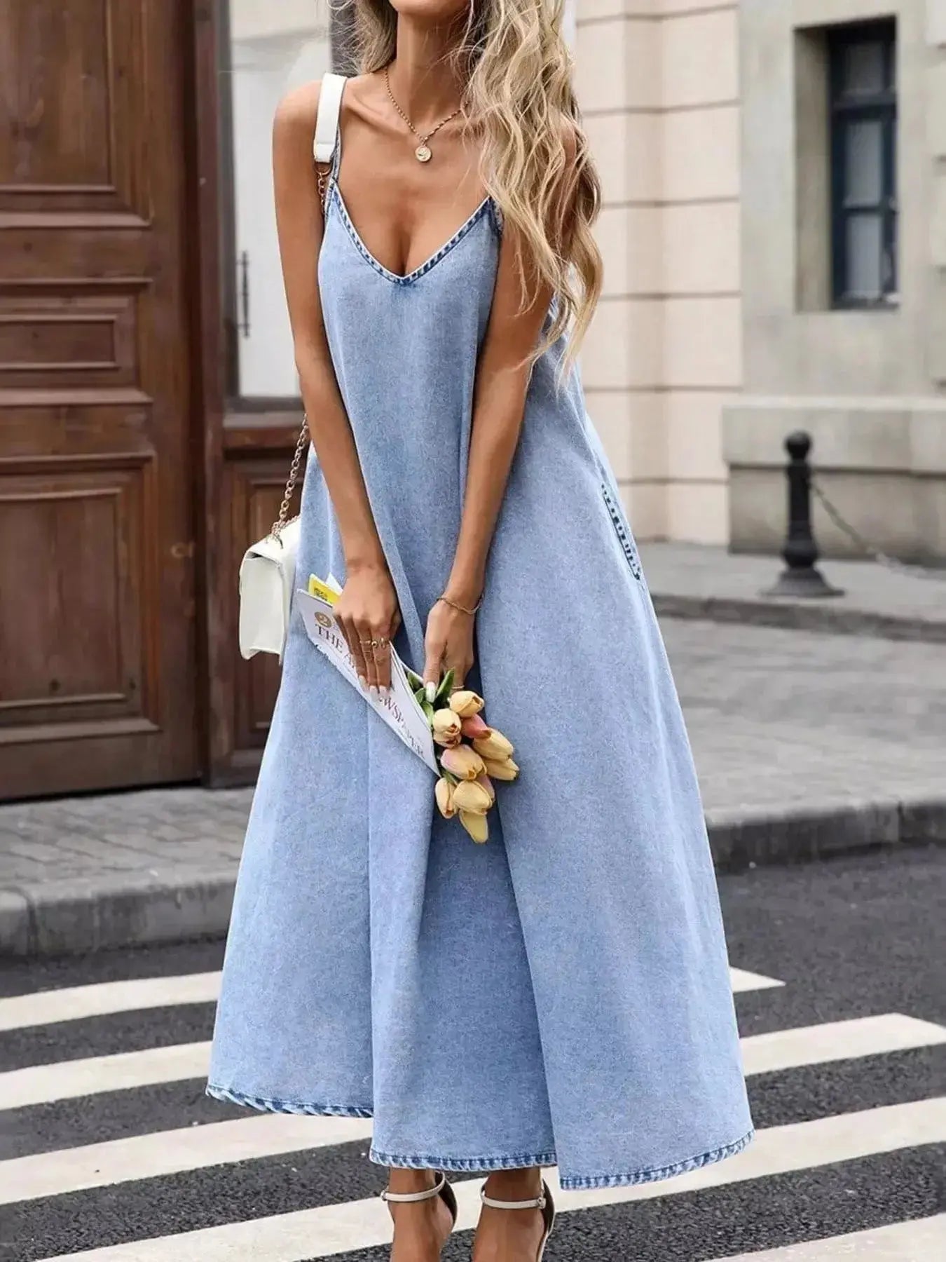 Women’s V-neck denim cami mini dress by Trendsi, sleeveless casual dress made of cotton blend fabric, perfect for warm weather.