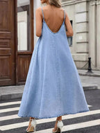 Women's V-neck denim cami mini dress by Trendsi, casual sleeveless cotton-blend denim dress with V-neck and mini length.