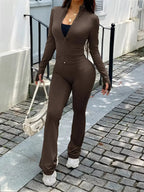 Women’s zip-up long sleeve active sweatsuit two-piece set by Trendsi, featuring a comfortable zip-up jacket and matching pants.
