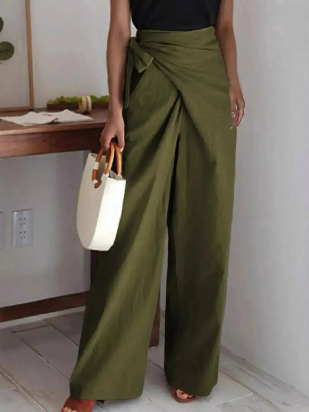 Women's wrap waist wide-leg flowing dress pants by Plush Fashion Hub, stylish and elegant bottoms with a comfortable fit.