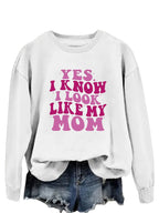 Plush Fashion Hub graphic sweatshirt featuring the phrase "Yes I Know I Look Like My Mom" on a cozy pullover sweater.